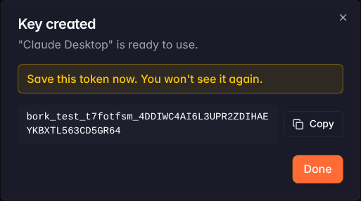 A new key's token, shown once at creation with a warning that it cannot be recovered